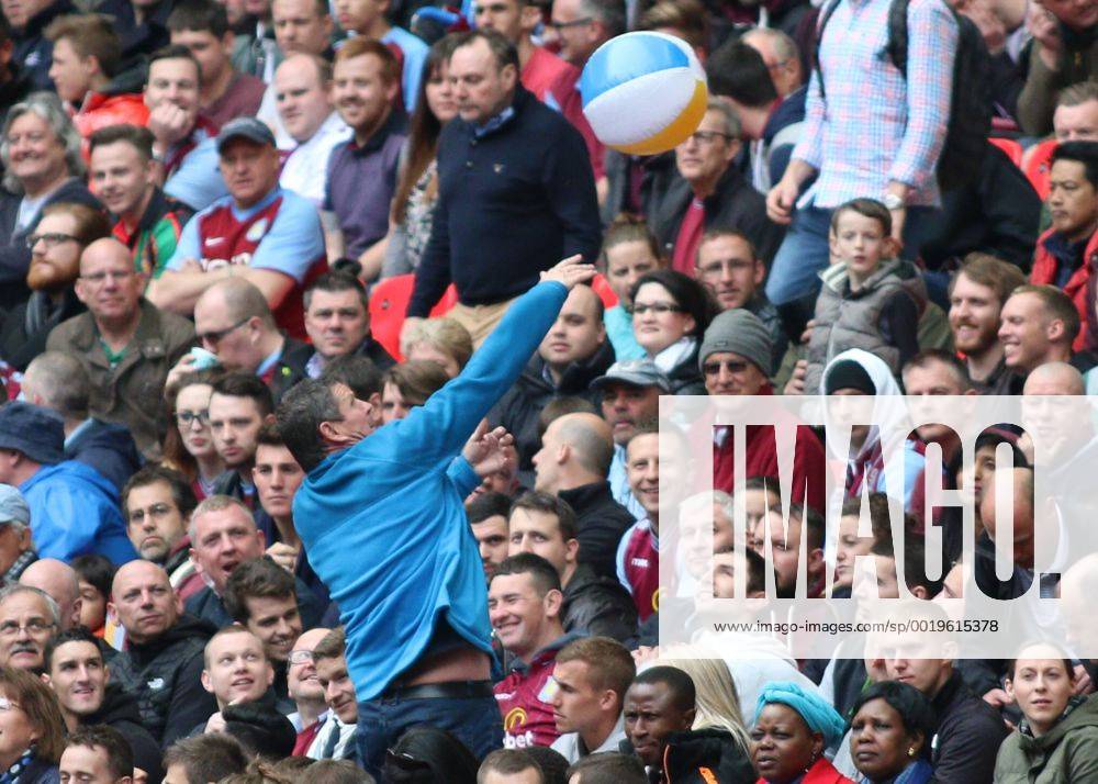 Football - 2014 2015 - FA Cup Semi Final, - Aston Villa Vs Liverpool, An Aston Villa celebrates taking the lead against Liverpool by passing a beach ball at Wembley Stadium COLORSPORT DANIEL BEARHAM AST_LIV