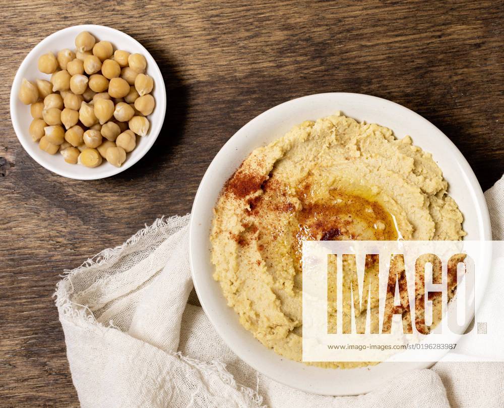IMAGO Creative, Food, Hummus top view bowl hummus with chickpeas. High quality and resolution beautiful photo concept top view bowl hummus with chickpeas. Resolution and high quality beautiful photo