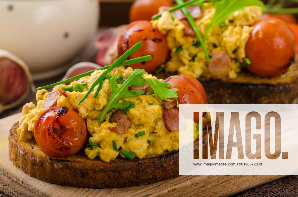 Scrambled eggs on toasted bread with bacon, herbs and tomato poached in balsamic reduction , 23000800.jpg, scrambled, eggs, breakfast, egg, bacon, food, fried, meal, fresh, plate, lunch, yellow, toast, white, healthy, dish, cooked, fork, brunch, delicious, morning, background, pan, closeup, bread, gourmet, omelet, dinner, microgreens, nobody, bio, organic, horizontal, traditional, meat, nutrition, appetizing, brown, sausage, rustic, tomato, bread, toasted, bacon, herbs, arugula, spinach, poached, balsamic, reduction,