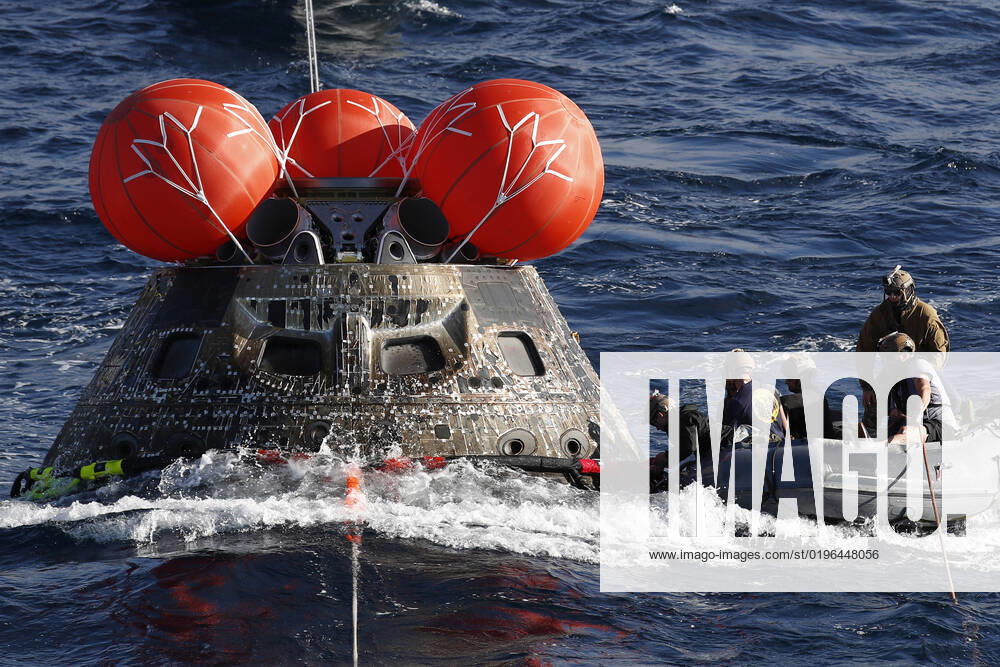 U.S. Navy divers attach winch cables to NASA s Orion capsule after being successfully secured off the coast of Baja California, Mexico, on Sunday, December 11, 2022. . The 26-day Artemis I mission took the Orion spacecraft to the moon and back to complete a historic flight. Pool CALP2022121190 CAROLINExBREHMAN