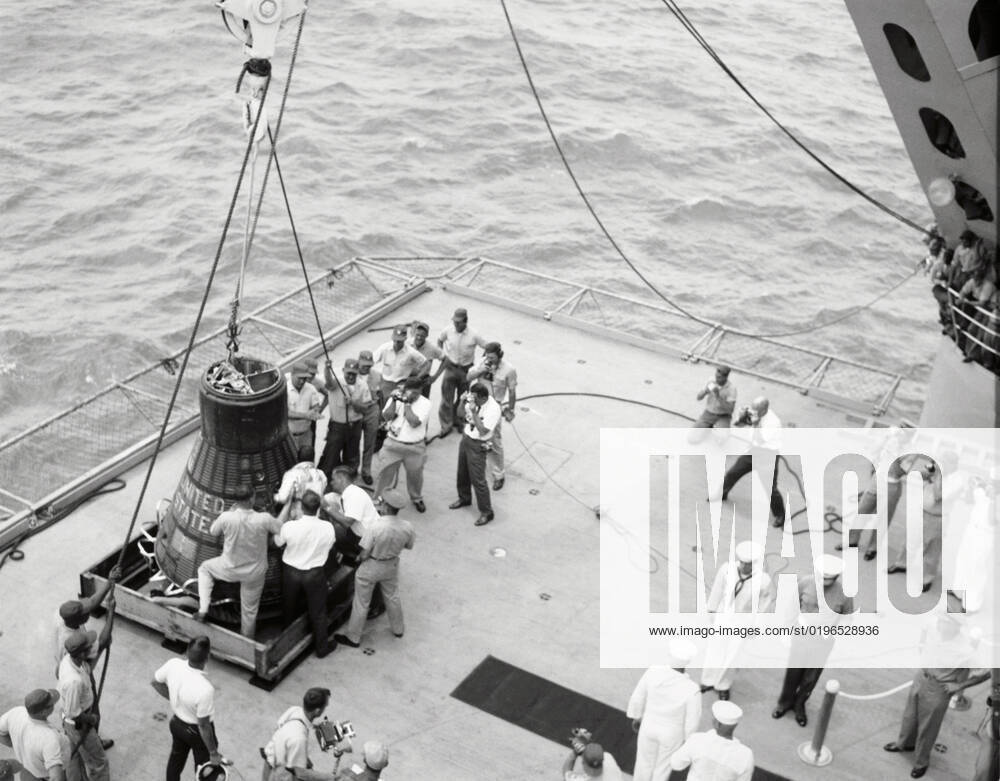 Gordon Cooper and capsule on deck, Pacific Ocean, 1963. Creator: NASA.