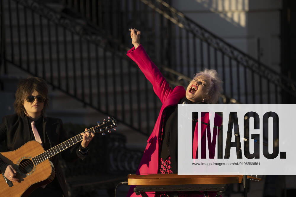 Singer Cyndi Lauper and guitarist Alex Nolan perform in a ceremony with US President Joe Biden to sign the Respect for Marriage Act on the South Lawn of the White House in Washington, DC on December 13, 2022.