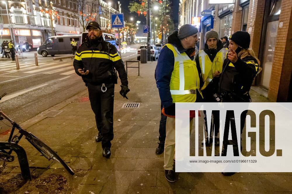 ROTTERDAM Volunteers and police with Moroccan football supporters after the semi final match between Morocco and France at the World Cup in Qatar ANP JEFFREY GROENEWEG netherlands out belgium out