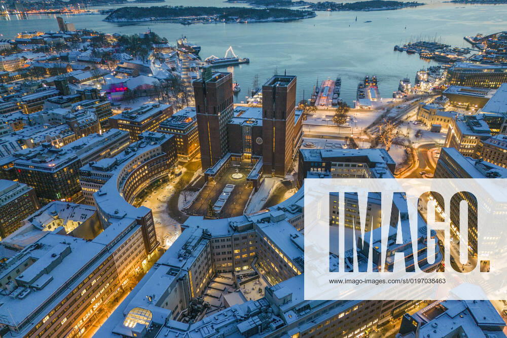 Oslo 20221218 Drone photo of Oslo City Hall, snow covered roofs and the Oslofjord Oslo Norway xx,