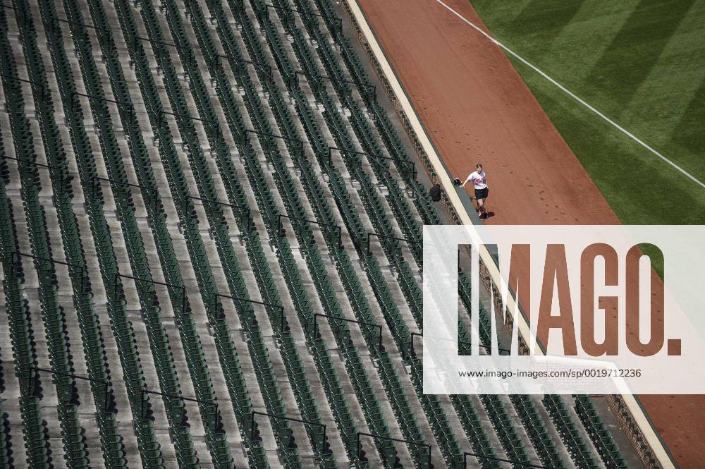 A ballgirl waits as the Baltimore Orioles play the Chicago White Sox at Orioles Park at Camden Yards, in Baltimore, Maryland on April 29, 2015. For the first time in Major League Baseball s history fans were not allowed to the game because of the ongoing civil unrest and protest in Baltimore in the wake of Freddie Gray s death. The late 25-year-old died earlier this month from a spinal injury while in police custody. BAL20150429320 KEVINxDIETSCH