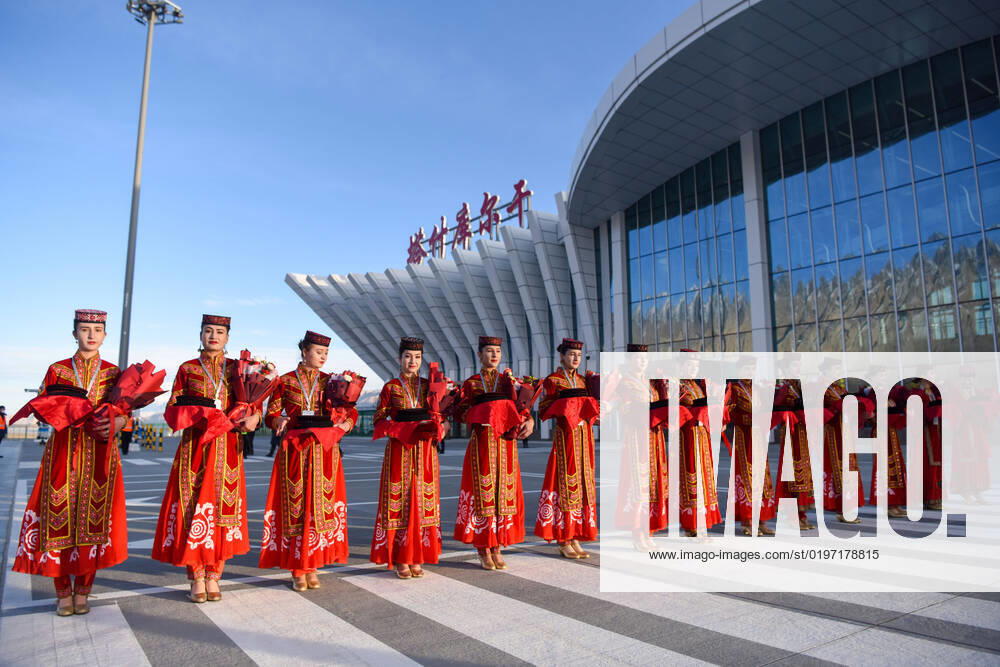 KW51 (221223) -- TAXKORGAN, Dec. 23, 2022 -- Local performers greet passengers boarding the first flight at the Taxkorgan airport in Taxkorgan Tajik Autonomous County, northwest China s Xinjiang Uygur Autonomous Region, Dec. 23, 2022. A passenger aircraft on Friday morning arrived in Taxkorgan Tajik Autonomous County, northwest China s Xinjiang Uygur Autonomous Region, marking the inauguration of the region s first high plateau airport. Departing from the regional capital Urumqi at 8:57 a.m., the flight CZ5193, operated by China Southern Airlines, landed at the Taxkorgan airport at 10:59 a.m. The airport, located at 3,258 meters above sea level, is China s westernmost transportation airport. Equipped with a 3,800-meter runway, the airport