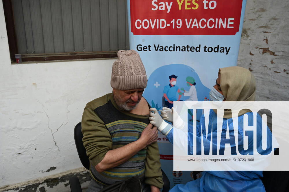 A man receives a shot of booster dose of COVID19 vaccine on December 27, 2022 in Srinagar, India. Reports of a massive surge in Covid-19 infections in China and apprehensions over the possibility of a spill-over effect in India has led to a sharp uptick in the vaccination intake in the country. In the past week on Friday (December 23) and Saturday, more than one lakh vaccinations were administered in India against an average of between 40,000 and 50,000 doses through most of this month.(Photo By Waseem Andrabi Hindustan Times) Amid China Scare, Covid Booster Vaccination Picks Up In India