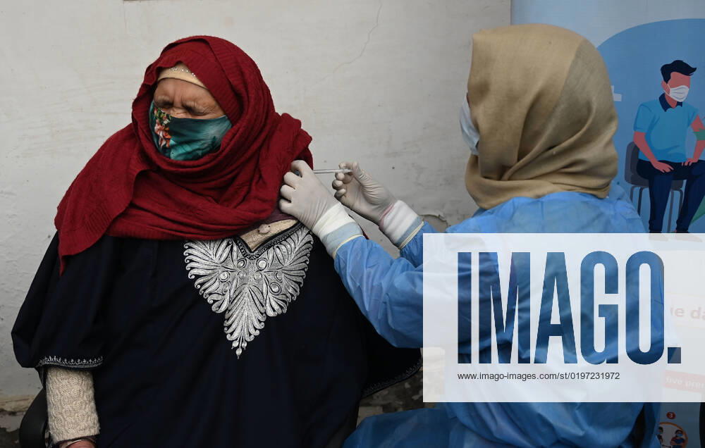 A woman receives a shot of booster dose of COVID19 vaccine on December 27, 2022 in Srinagar, India. Reports of a massive surge in Covid-19 infections in China and apprehensions over the possibility of a spill-over effect in India has led to a sharp uptick in the vaccination intake in the country. In the past week on Friday (December 23) and Saturday, more than one lakh vaccinations were administered in India against an average of between 40,000 and 50,000 doses through most of this month.(Photo By Waseem Andrabi Hindustan Times) Amid China Scare, Covid Booster Vaccination Picks Up In India