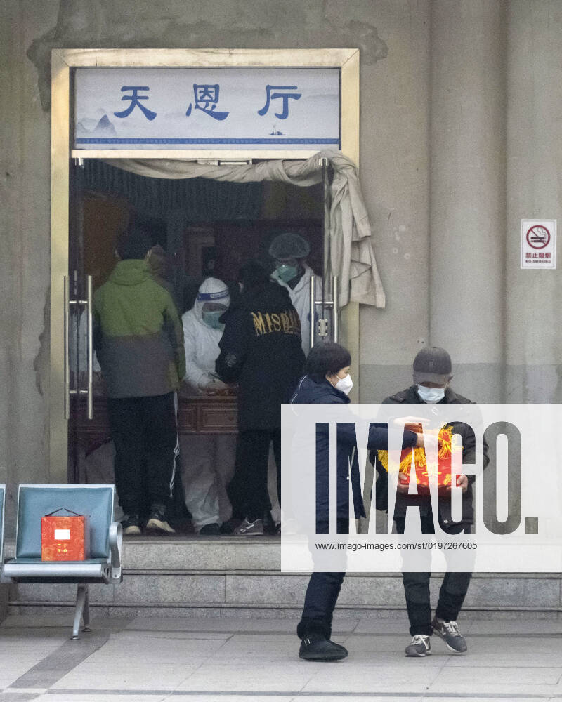 Wuhan amid COVID surge An official in protective gear attends to guests at a funeral hall in Wuhan on Dec. 29, 2022, amid a surge in COVID-19 cases. The Chinese government eased its strict antivirus measures earlier in the month. A14AA0001380145P