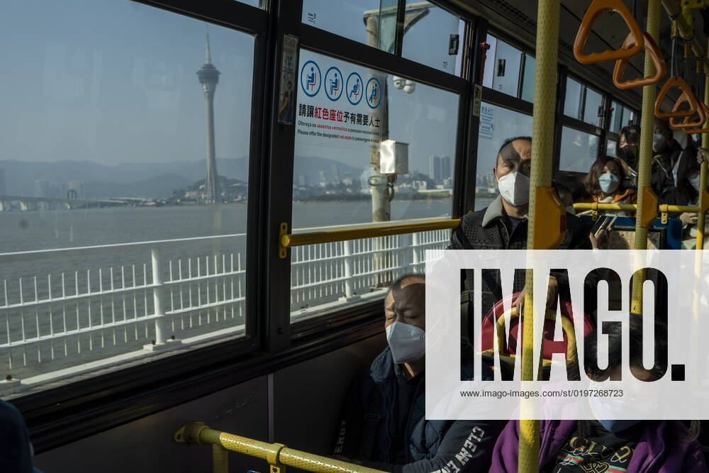 Daily Life In Macau Commuters wearing face masks while riding on a bus on December 29, 2022 in Macau, China. Macau Macau