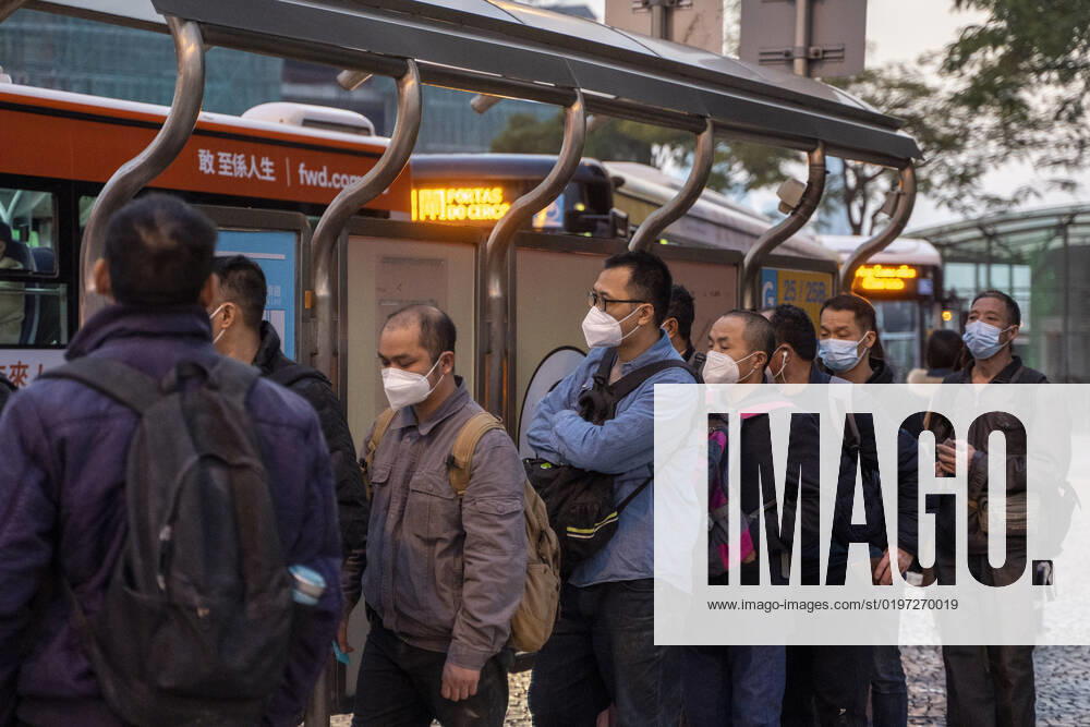 Daily Life In Macau Commuters wearing face masks while waiting for public bus on December 29, 2022 in Macau, China. Macau Macau