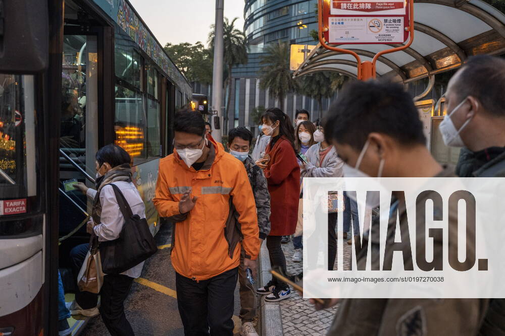 Daily Life In Macau Commuters wearing face masks waiting for buses on December 29, 2022 in Macau, China. Macau Macau