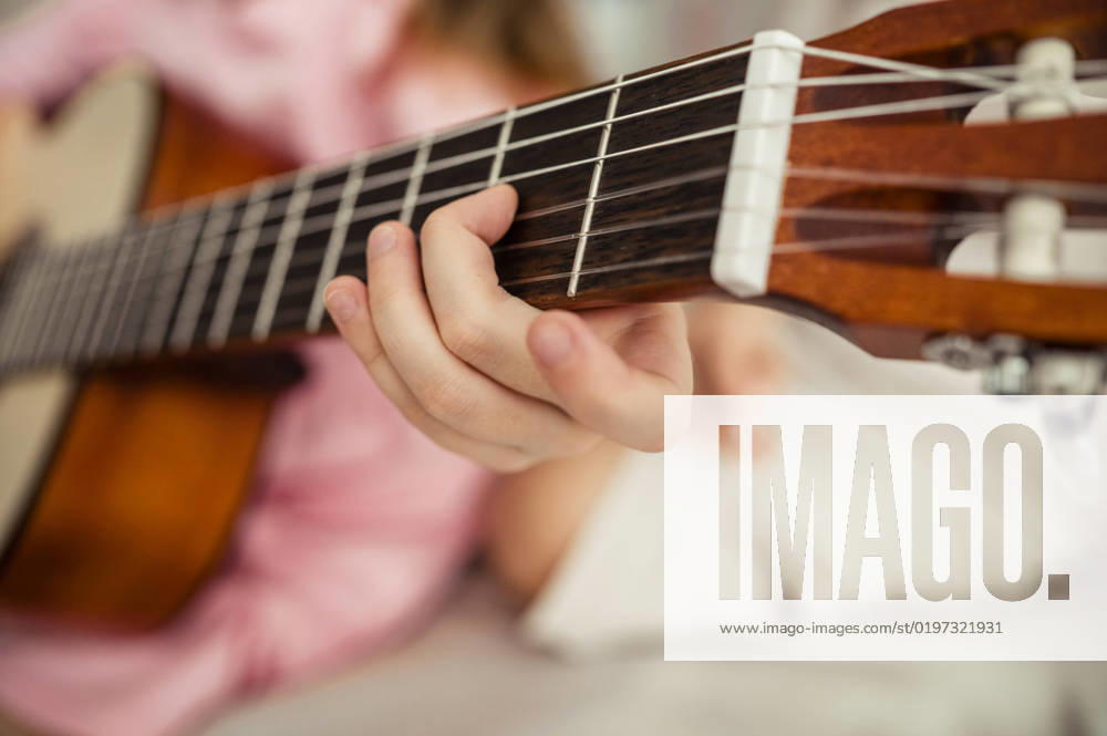 Hand of girl playing guitar at home model released, Symbolfoto property released, ANAF00633