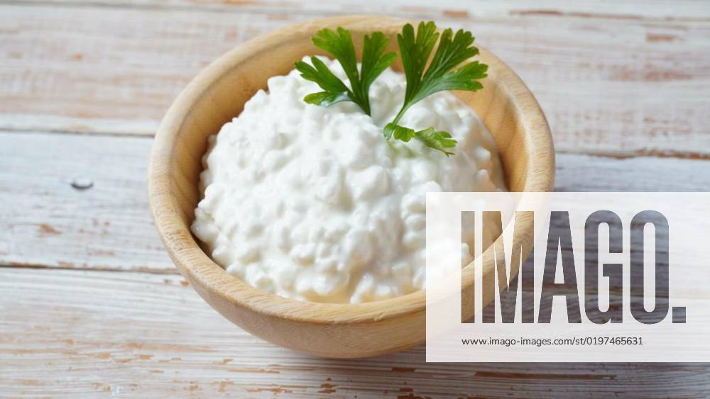 Cottage cheese in a bowl on a wooden background. Diet and healthy eating concept, Cottage cheese in a bowl on a wooden background. Diet and healthy eating concept, Cottage cheese in a bowl on a wooden background. Diet and healthy eating concept, 10.09.2022,
