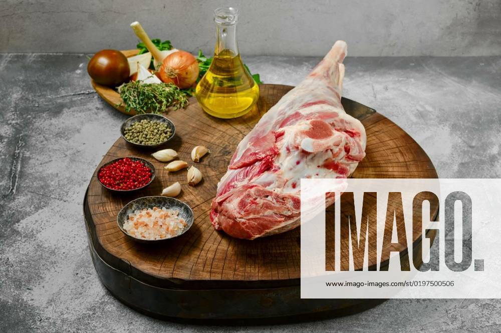 Raw whole lamb leg chump on with ingredients, Raw whole lamb leg chump on with ingredients on wooden stump, Raw whole lamb leg chump on with ingredients on wooden stump, 21.09.2022,