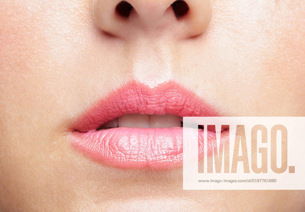 Closeup macro portrait of female part of face. Human woman lips with day beauty makeup Human mouth and nose. Closeup macro portrait of female part of face. Woman lips with day beauty makeup.