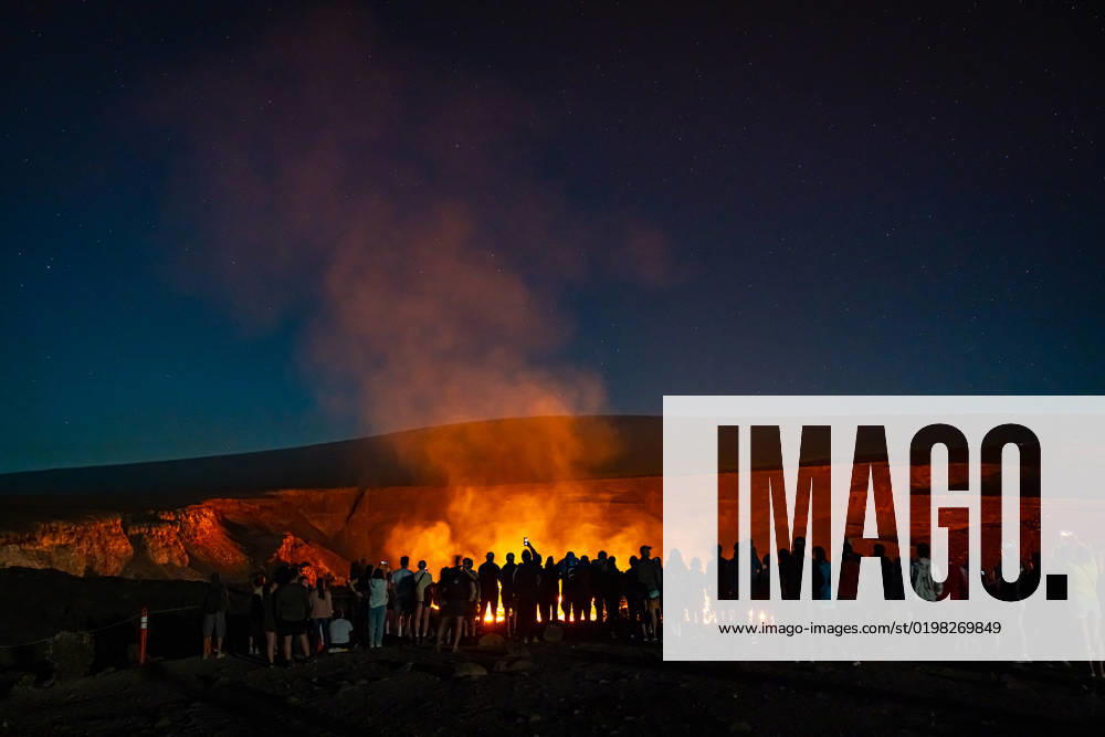 VOLCANO, HI - January 7, 2023: Spectators observe the eruption pictured as Hawaii?s Kilauea volcano eruption continued after re-erupting on January 5th in Volcano, HI on January 7, 2023.