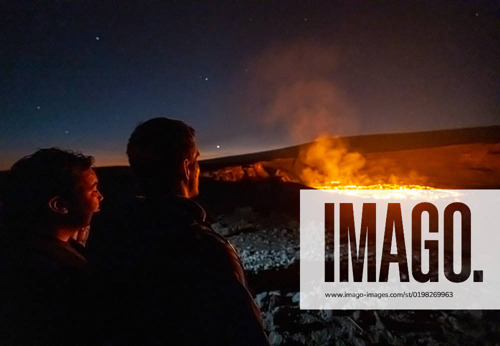 VOLCANO, HI - January 7, 2023: Spectators observe the eruption pictured as Hawaii?s Kilauea volcano eruption continued after re-erupting on January 5th in Volcano, HI on January 7, 2023.