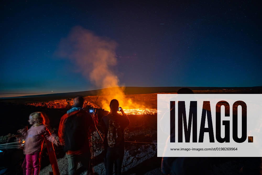 VOLCANO, HI - January 7, 2023: Spectators observe the eruption pictured as Hawaii?s Kilauea volcano eruption continued after re-erupting on January 5th in Volcano, HI on January 7, 2023.
