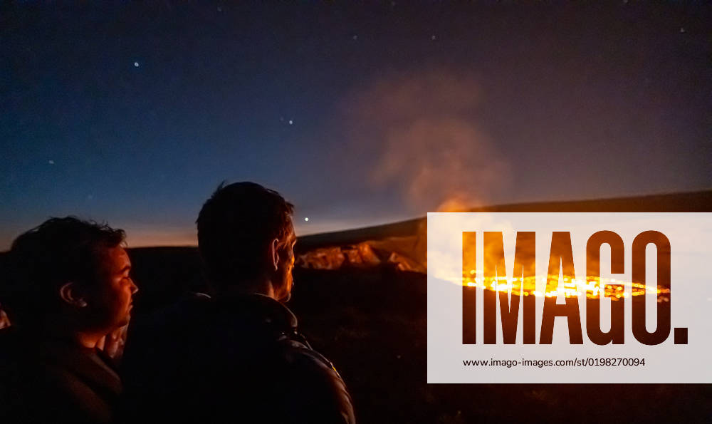 VOLCANO, HI - January 7, 2023: Spectators observe the eruption pictured as Hawaii?s Kilauea volcano eruption continued after re-erupting on January 5th in Volcano, HI on January 7, 2023.