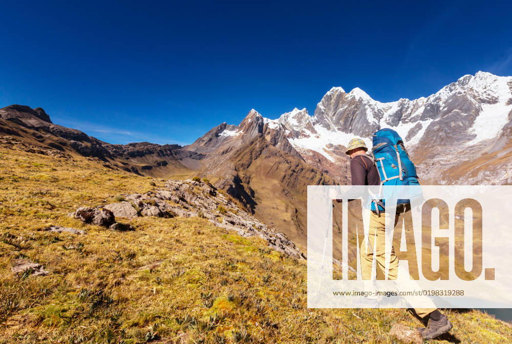 Hiking scene in Cordillera mountains, Peru, model released, , 26379222.jpg, adventure, Andes, background, backpack, camping, campsite, climbing, Cordillera, discovery, ecology, environment, equipment, expedition, explorer, extreme, fitness, freedom, happiness, healthy, hiking, human, landscape, lifestyle, male, mountaineering, mountaineers, mountains, nature, outdoor, people, person, Peru, recreation, relaxation, rural, South America, sport, summer, survival, tourism, tourist, touristic, travel, traveler, traveling, trekking, trip, walking, way, wild,