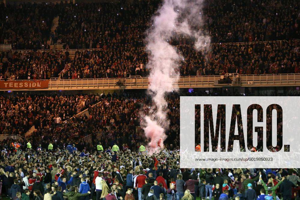 A smoke bomb is let off as fans invade the pitch - Middlesbrough vs. Brentford - Skybet Championship - Play Off Second Leg - Riverside Stadium - Middlesbrough - 15 05 2015 Pic Philip Oldham Sportimage .