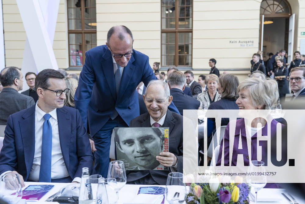 Ceremony Wolfgang Schäuble 50 years in the German Bundestag Friedrich Merz hands over to Wolfgang Schäuble a pressed record with o