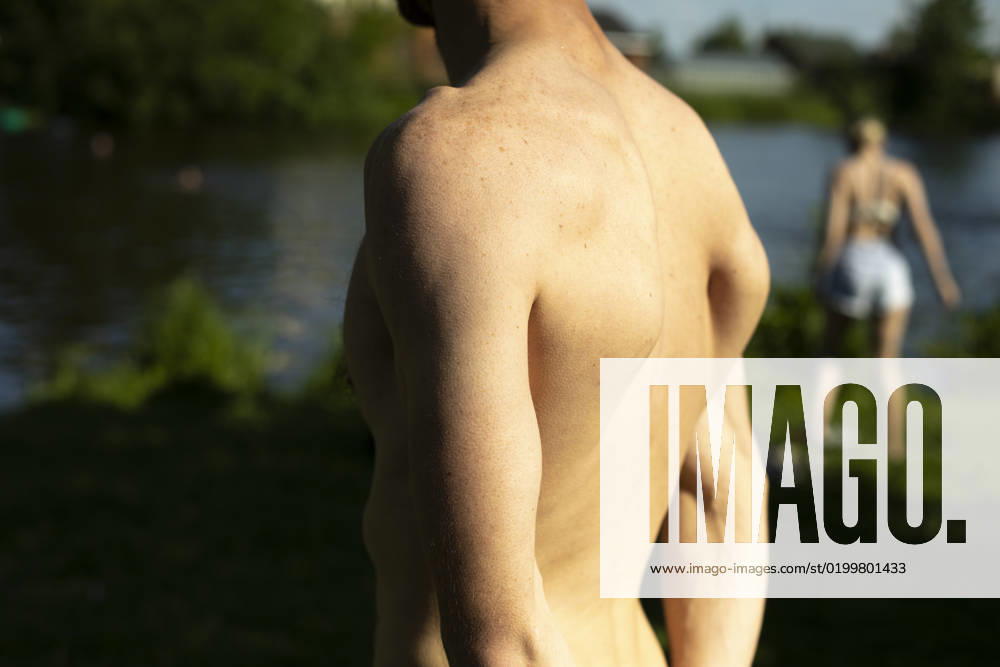 Guy s back in summer. Man s bare back on hot day. Moscow, Moscow, Russia R_UEFCLG2301170D-1109296-01