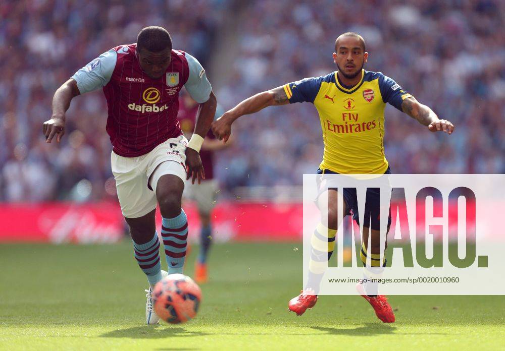 Jores Okore of Aston Villa battles Arsenal s Theo Walcott - Arsenal vs. Aston Villa - FA Cup Final - Wembley Stadium - London - 30 05 2015 Pic Philip Oldham Sportimage .