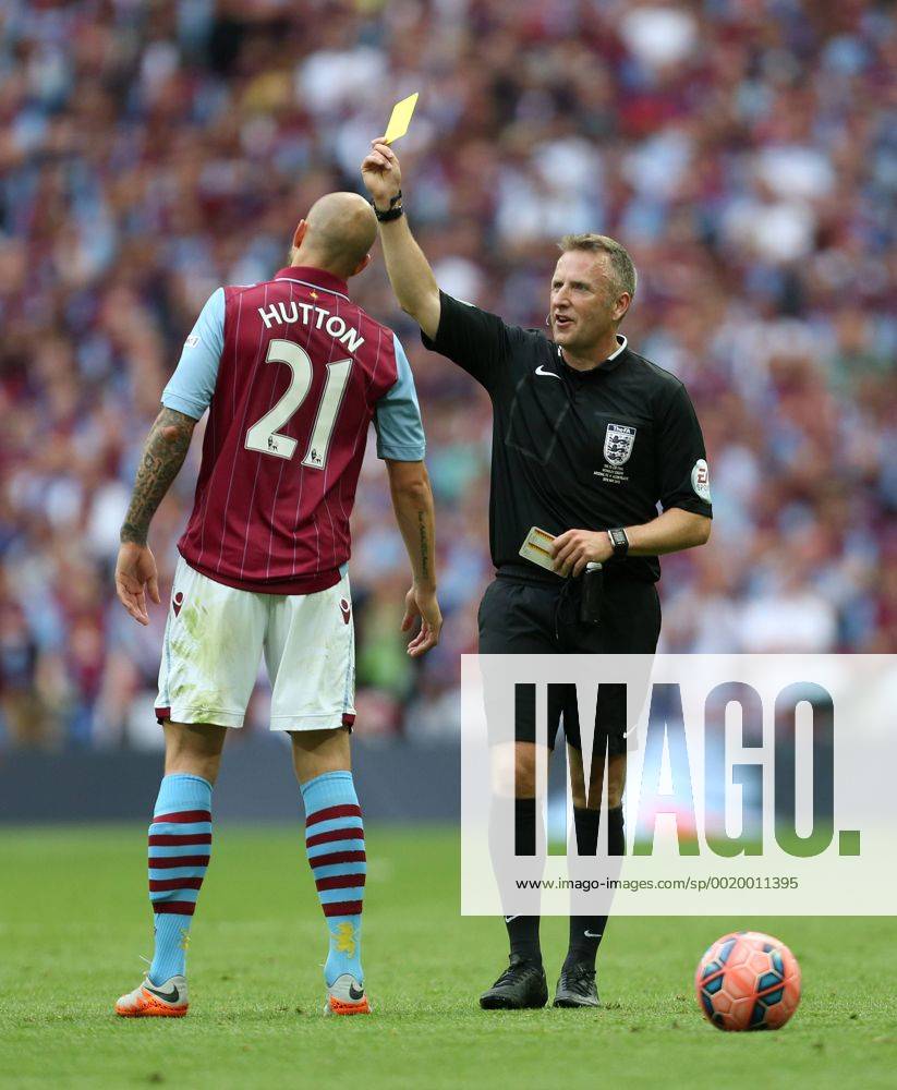 Alan Hutton of Aston Villa is shown a yellow card by referee Jon Moss - Arsenal vs. Aston Villa - FA Cup Final - Wembley Stadium - London - 30 05 2015 Pic Philip Oldham Sportimage .