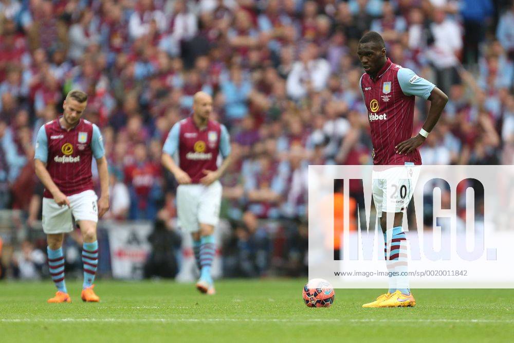 Christian Benteke of Aston Villa left dejected following Arsenal s second goal - Arsenal vs. Aston Villa - FA Cup Final - Wembley Stadium - London - 30 05 2015 Pic Philip Oldham Sportimage .
