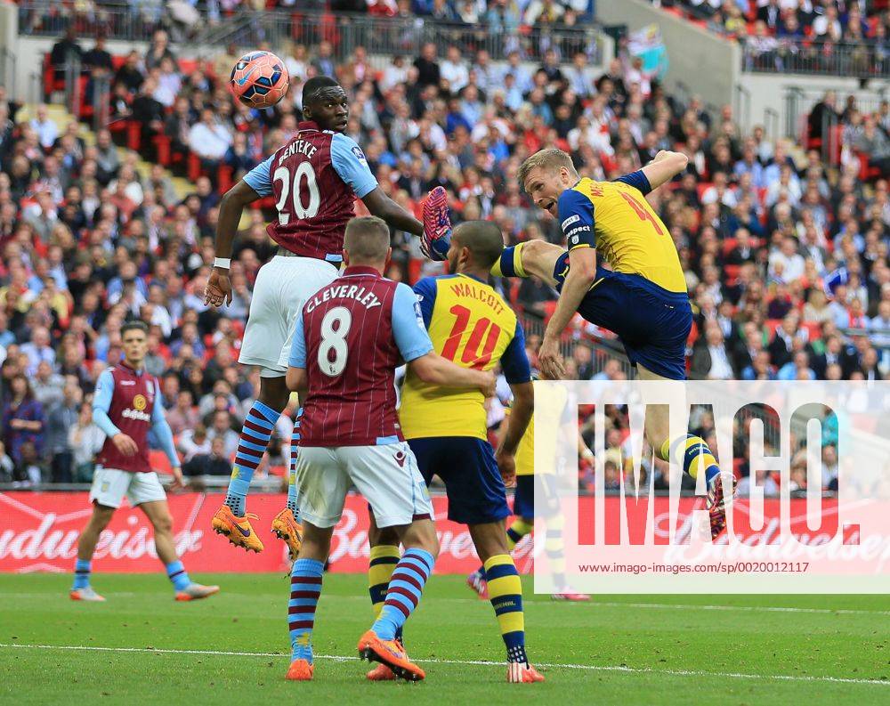 Arsenal s Per Mertesacker scoring his sides third goal FA Cup Final - Arsenal vs Aston Villa - Wembley Stadium - England - 30th May 2015 - Picture David Klein Sportimage .