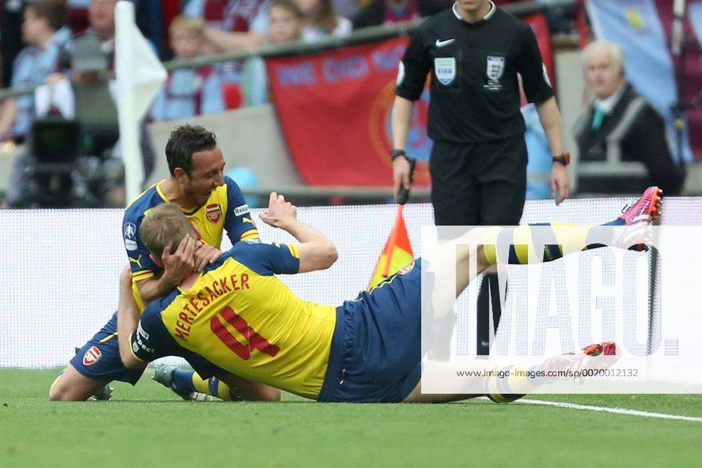 Arsenal s Per Mertesacker celebrates scoring his sides third goal - Arsenal vs. Aston Villa - FA Cup Final - Wembley Stadium - London - 30 05 2015 Pic Philip Oldham Sportimage .