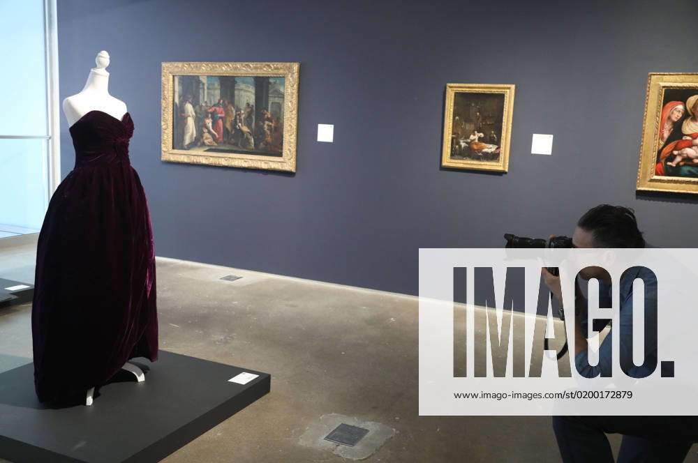 A photographer takes a photo of the historic Princess Diana dress by Victor Edelstein (Autumn 1989), seen on display for the first time in over 25 years at SothebyÃ¢â‚¬â ¢s New York Masters Week Ã¢â‚¬ËœThe OneÃ¢â‚¬â ¢ auction. The purple strapless evening dress was worn in a royal portrait in 1991, and later appeared in Vanity Fair in 1997, shot by Mario Testino during a portrait session with Princess Diana in one of her most iconic and favorite dresses of all time. The dress is expected to sell for $80,000 - $120,000. New York City USA - ZUMAk03_ 20230120_zaf_k03_008