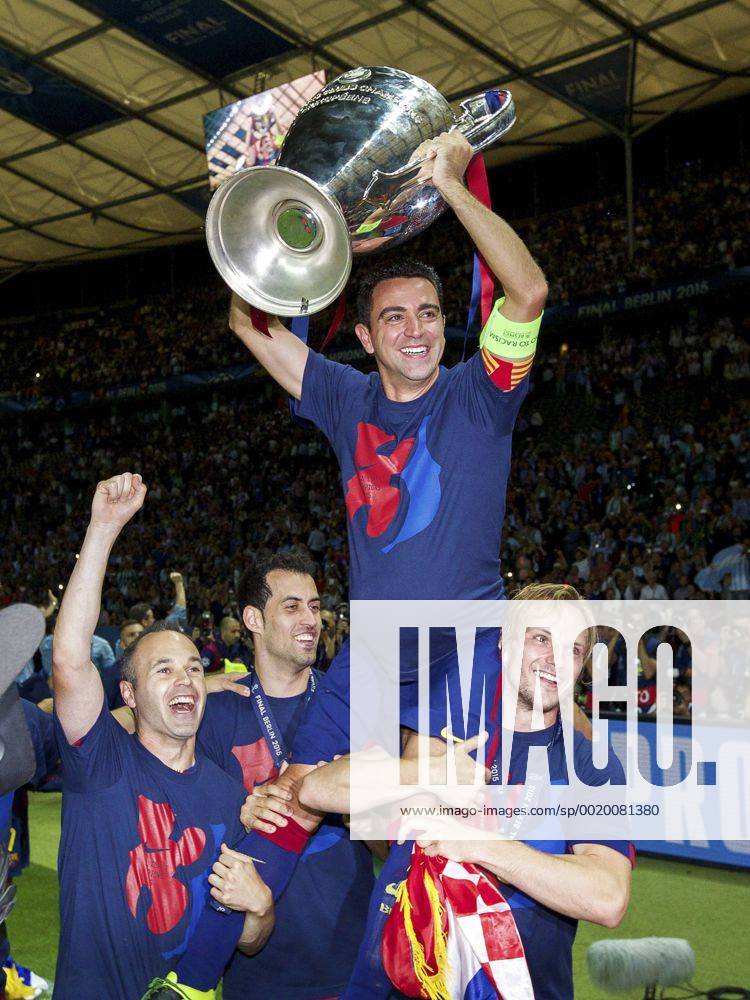 (L-R) Andres Iniesta of FC Barcelona Barca Sergio Busquets of FC Barcelona, Xavi Hernandez of FC Barcelona, Ivan Rakitic of FC Barcelona with Champions League trophy during the UEFA Champions League final match between Barcelona and Juventus on June 6, 2015 at the Olympic stadium in Berlin, Germany. Barcelona v Juventus Champions League final 2014 2015 IVx 3946789