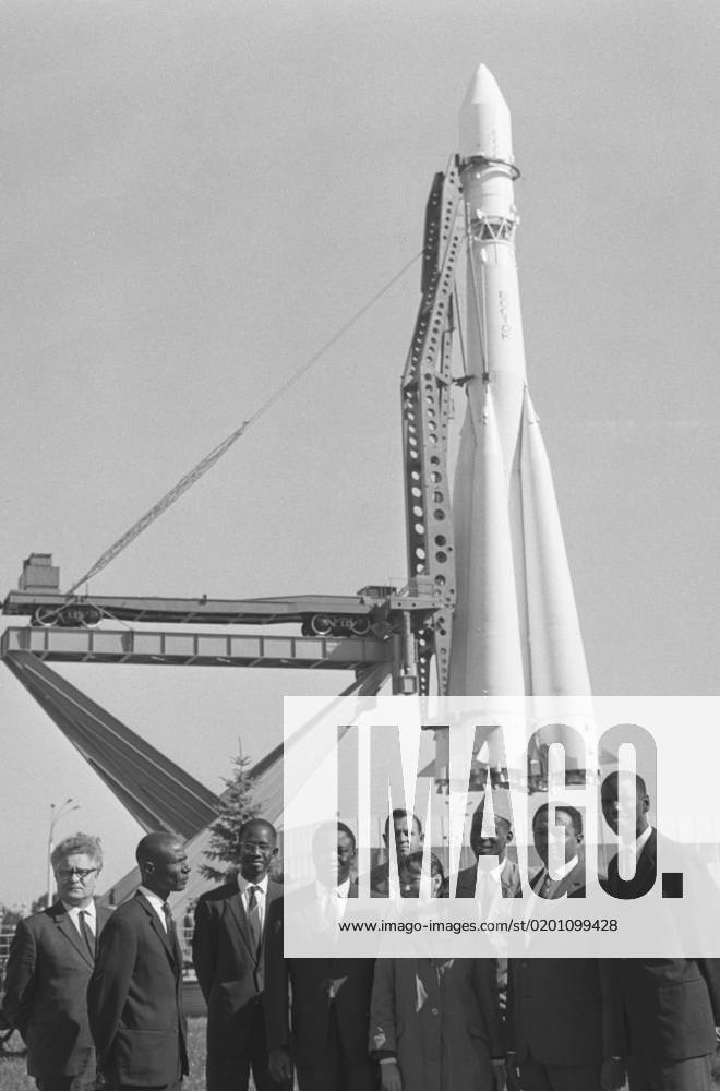 Moscow, USSR. September 17, 1967. Members of the government economic delegation of the Republic of Guinea headed by Minister of State for Finance and Planning of the Republic of Guinea Saifoulaye El Hadj Diallo (not pictured) pose for photos near the model of the Vostok spacecraft at the Exhibition of Achievements of National Economy of the USSR. Nikolai Sitnikov TASS 18491805