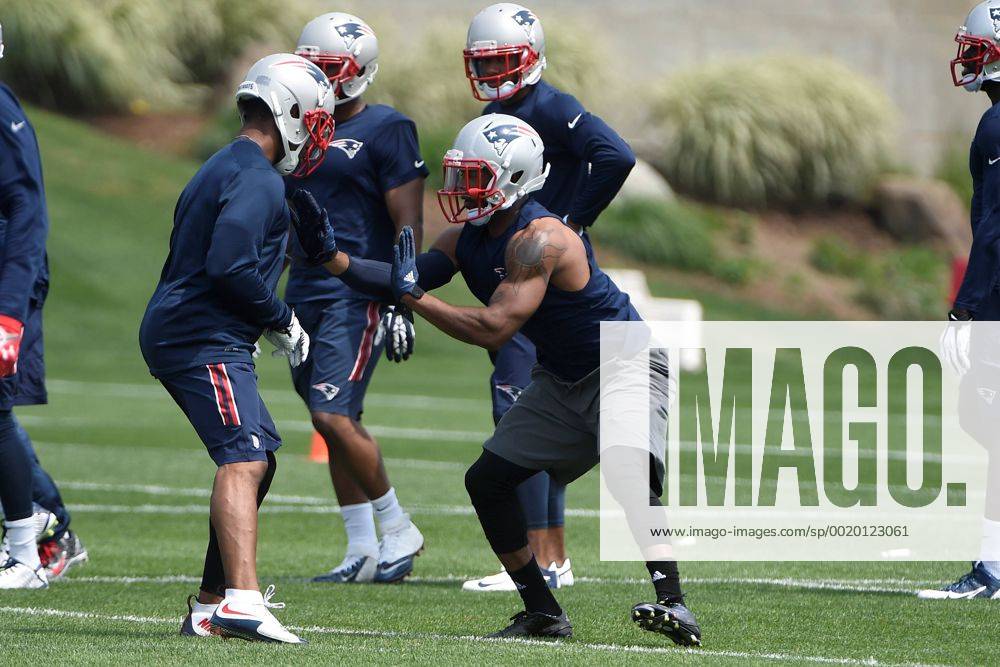 Foxborough, Massachusetts, U.S. - New England Patriots corner back Malcolm Butler (21) (right) works with a member of the team during the organized team activities held on the practice fields at Gillette Stadium in Foxborough Massachusetts. Eric Canha CSM NFL American Football Herren USA 2015: Patriots OTA JUN 11 - ZUMAc04_