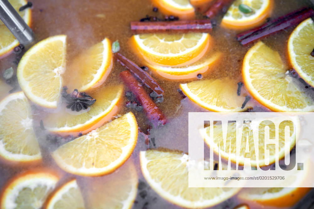 Closeup of mulled wine citrus fruit, preparing in big old metal kettle on fire, above view, Traditional Christmas fair market beverage , 35037278.jpg, mood, wine, warm, punch, relax, smoke, apple, prepare, seasonal, boiler, heat, steam, seasoning, xmas, adding, citron, condiment, festive, piece, christmas, drink, alcohol, holiday, hot, orange, spice, pot, pan, cinnamon, slice, making, red, anise, aromatic, cosiness, grog, metal, beverage, fruit, traditional, winter, cooking, mulled, citrus