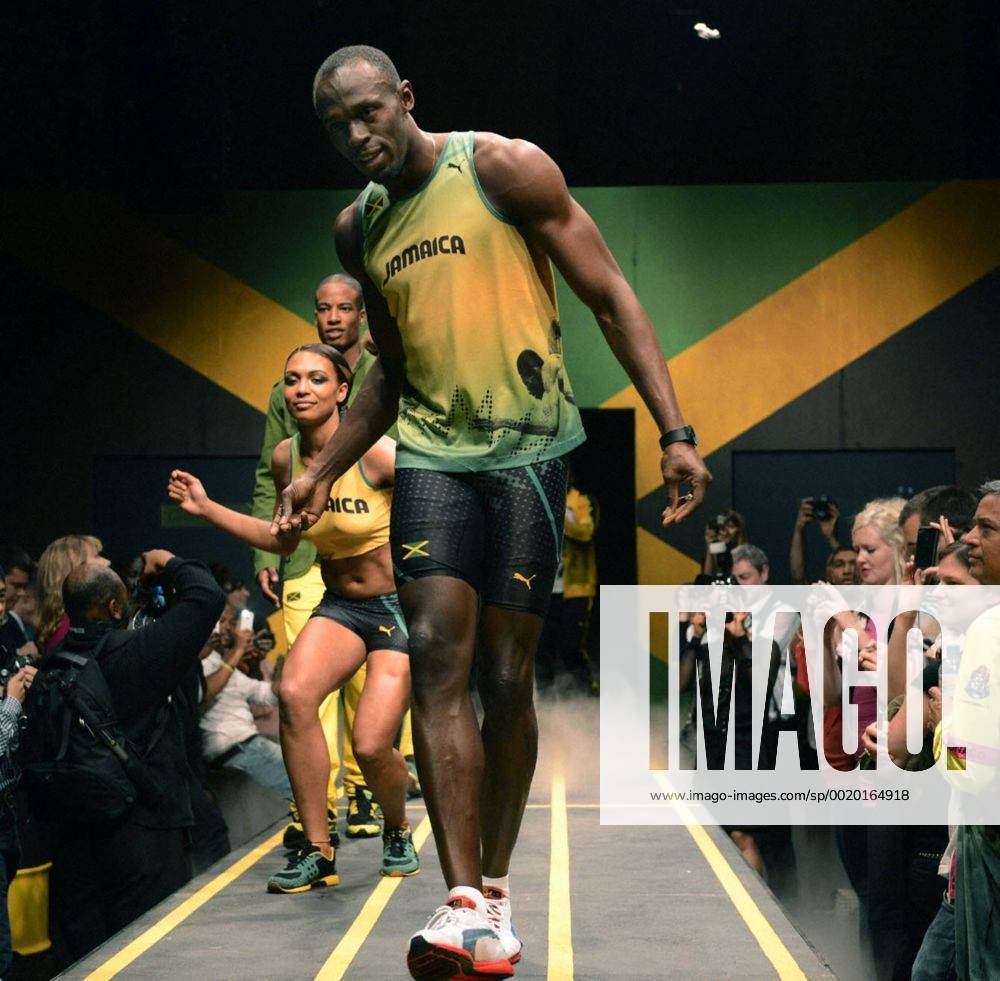 LONDON, Britain - Jamaican sprinter Usain Bolt (C front), three-time Olympic gold medalist and world record holder in the 100 meters, wears his country s kit for the upcoming London Olympics during an event in London on June 1, 2012. 0602012