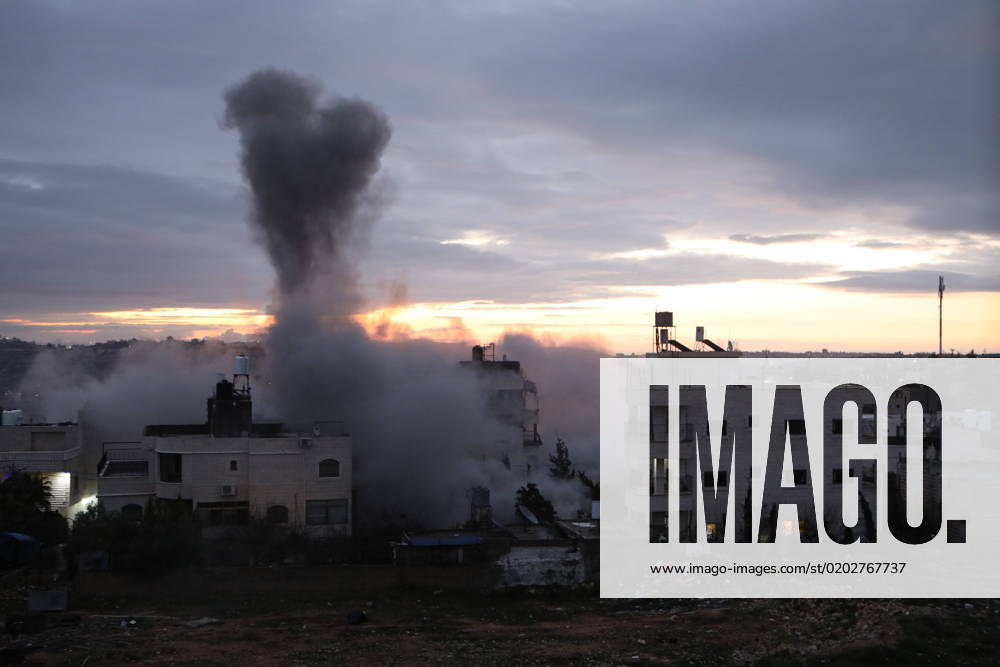 An explosion is seen as the Israeli army demolishes the house of a Palestinian man who carried out a shooting attack in the Jewish settlement of Kiryat Arba An explosion is seen as the Israeli army demolishes the house of a Palestinian man who carried out a shooting attack in the Jewish settlement of Kiryat Arba, in the West Bank city of Hebron, on February 16,2023. Israeli forces early Thursday exploded the house of Mohammad Kamal Jabari, a 35-year-old Palestinian who was shot dead last October by the forces outside the illegal Israeli settlement of Kiryat Arba. Photo by Mamoun Wazwaz Hebron West Bank Palestinian Territory 160223_HEBRON_MW_00 (10)