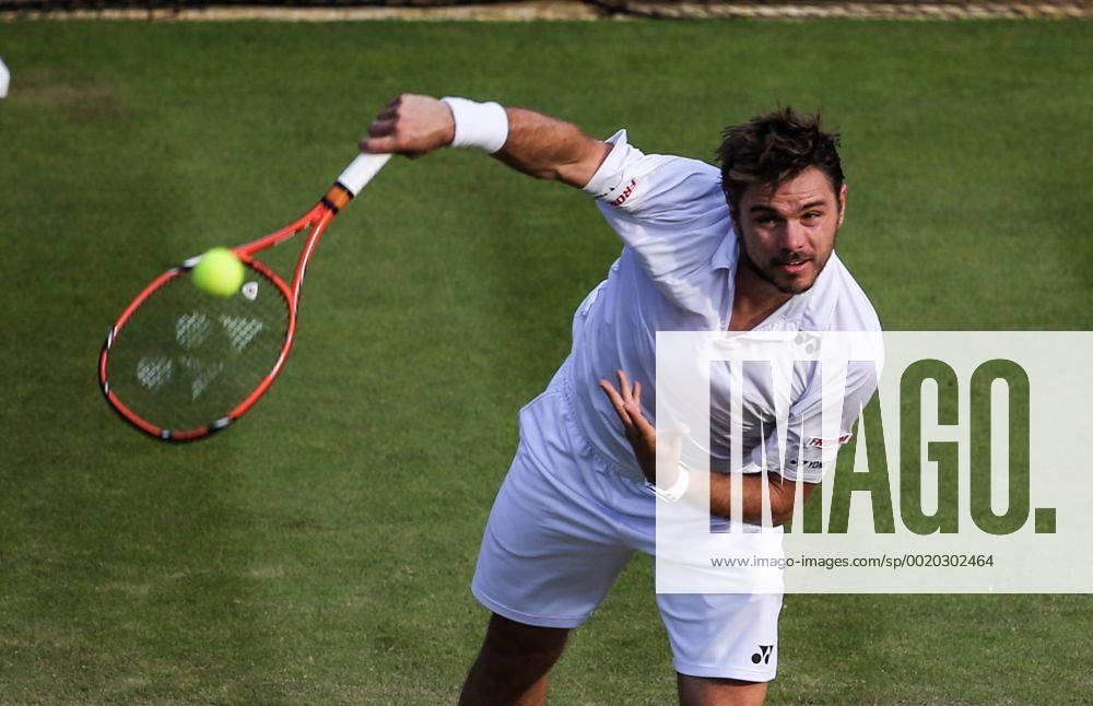 (150702) -- LONDON, Stan Wawrinka of Switzerland serves to Victor Estrella Burgos of the Dominican Republic during the men s singles second round match at 2015 Wimbledon Tennis Championships in London, Britain, July 1, 2015. Wawrinka won 3-0. ) (SP)BRITAIN-LONDON-TENNIS-WIMBLEDON CHAMPIONSHIPS TangxShi
