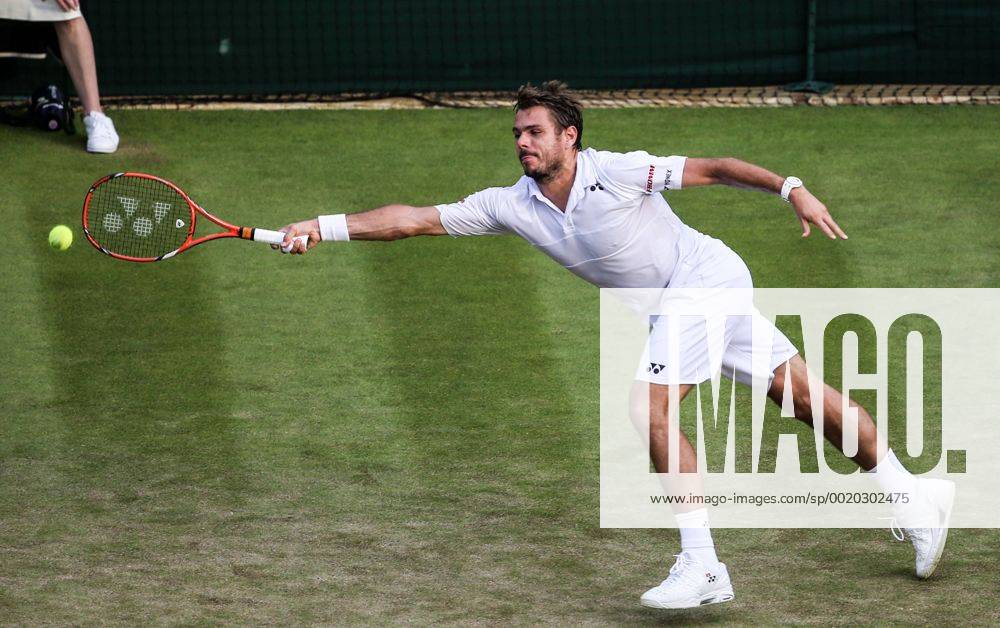 (150702) -- LONDON, Stan Wawrinka of Switzerland returns the ball to Victor Estrella Burgos of the Dominican Republic during the men s singles second round match at 2015 Wimbledon Tennis Championships in London, Britain, July 1, 2015. Wawrinka won 3-0. ) (SP)BRITAIN-LONDON-TENNIS-WIMBLEDON CHAMPIONSHIPS TangxShi
