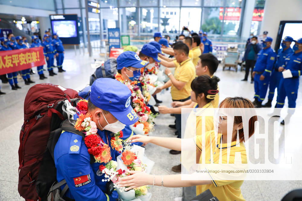 Members of Hainan Blue Sky Rescue (BSR) team are welcomed with flowers at Haikou Meilan International Airport after completing rescue and search mission in quake-hit Turkiye on February 20, 2023 in Haikou, Hainan Province of China. Seven members of Hainan Blue Sky Rescue Team arrived at Haikou Meilan International Airport on Monday.