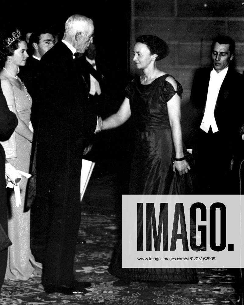 STOCKHOLM 1935 12 10 King Gustaf V awards the Nobel Prize in Chemistry to Madame Irene Curie Joliot, daughter of Pierre and Marie Curie, who receives the prize with her husband Frà dà ric Joliot Curie on the right