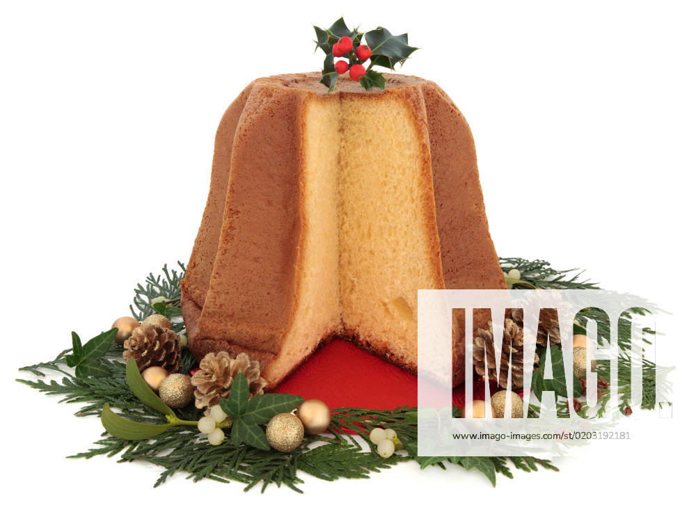 Pandoro christmas cake with holly, gold bauble clusters, mistletoe, ivy, pine cone and cedar cypress leaf sprig decorations over white background.