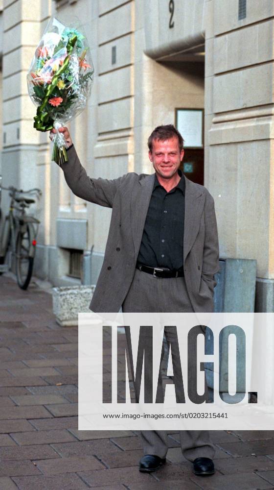 SCANPIX SWEDEN, 1997 10 16 Krister Henriksson, injured player, received the O neill scholarship Henriksson walks on a pavement and holds up a bouquet of flowers