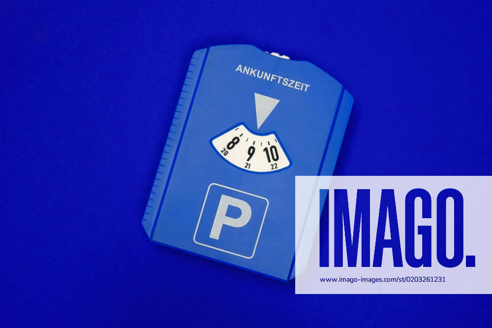 Parking disc parking disc, 19 02 2023, Borkwalde, Brandeburg, A parking disc lies on a blue background
