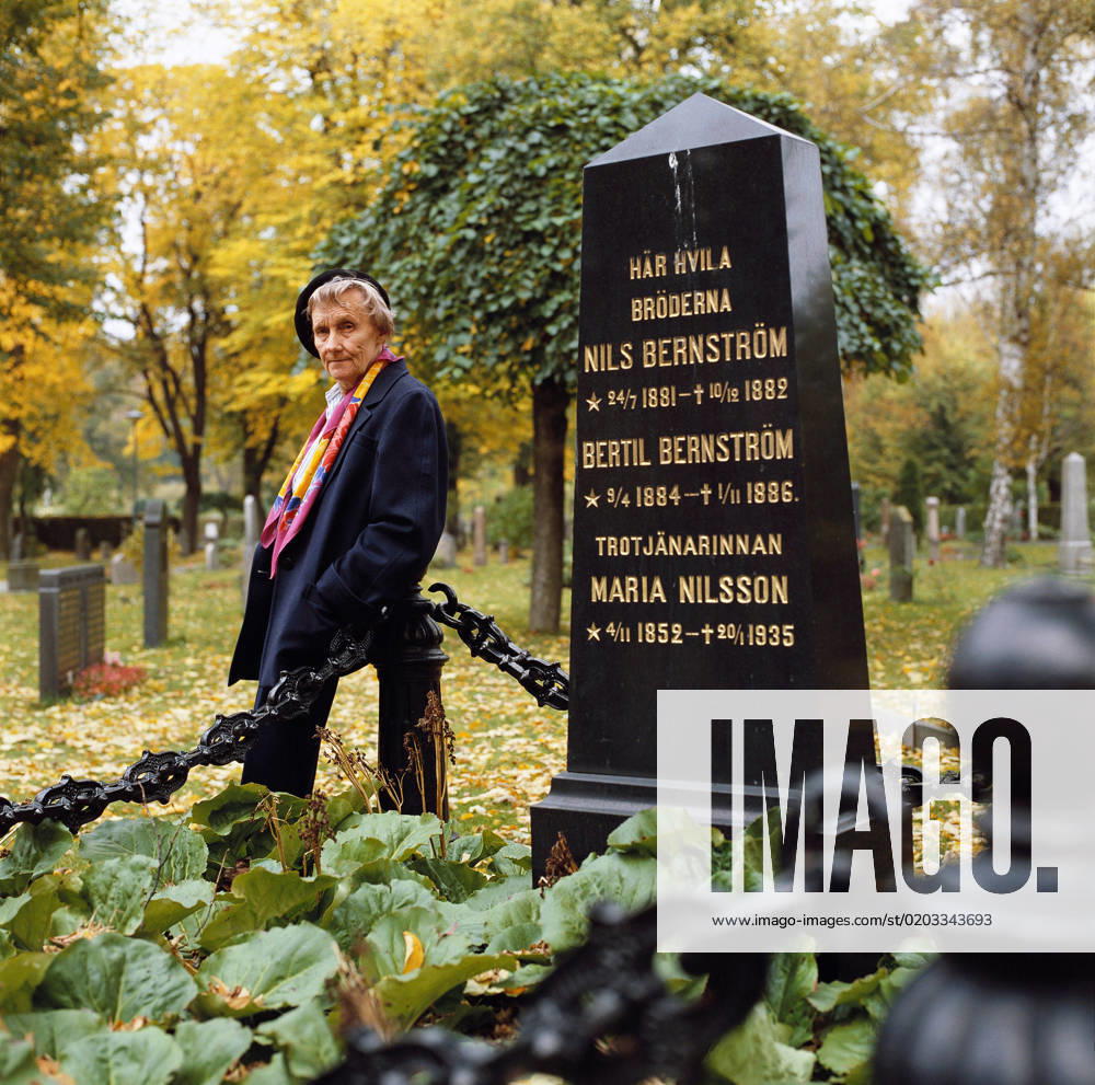 Swedish writer Astrid Lindgren stands next to a headstone with the inscription Here rests brothers Nils Bernström, Bertil Bernström, faithful servant Maria Nilsson at Norra begravningsplatsen in Solna, Stockholm, Sweden, October 12, 1987 Stockholm Sweden