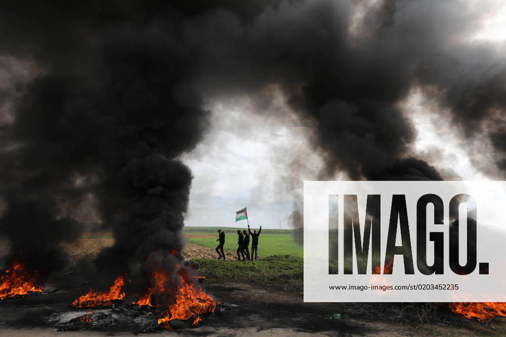 KW08 Palestinian youths burn tyres during a protest near the Israel-Gaza border east of Jabalia refugee camp Palestinian youths burn tyres during a protest near the Israel-Gaza border east of Jabalia refugee camp on Feb. 23, 2023. Israel and Palestinian militants traded air strikes and rocket fire in and around Gaza, a day after the deadliest Israeli army raid in the occupied West Bank in nearly 20 years. Photo by Ashraf Amra apaimages Jabalia Gaza Strip Palestinian Territory 230223_JABALIA_ASH_00 (45)