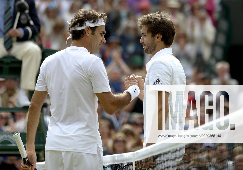 -- Roger Federer (L) of Switzerland shakes hands with Gilles Simon of France after winning men s quarterfinal match against Gilles Simon of France at the 2015 Wimbledon Championships in Wimbledon, southwest London, July 8, 2015. Federer won the game 6-3, 7-5 and 6-2. ) (SP)BRITAIN-LONDON-TENNIS-WIMBLEDON CHAMPIONSHIPS YexPingfan